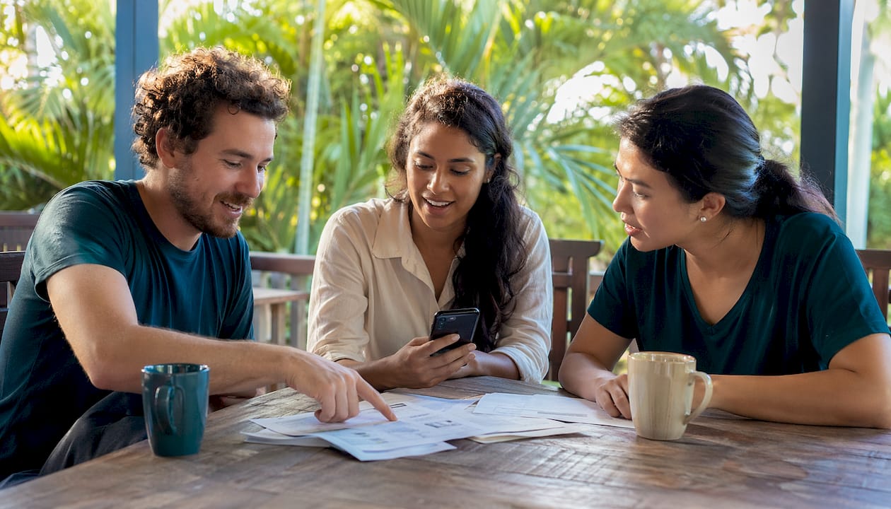 Young adults budgeting expenses together