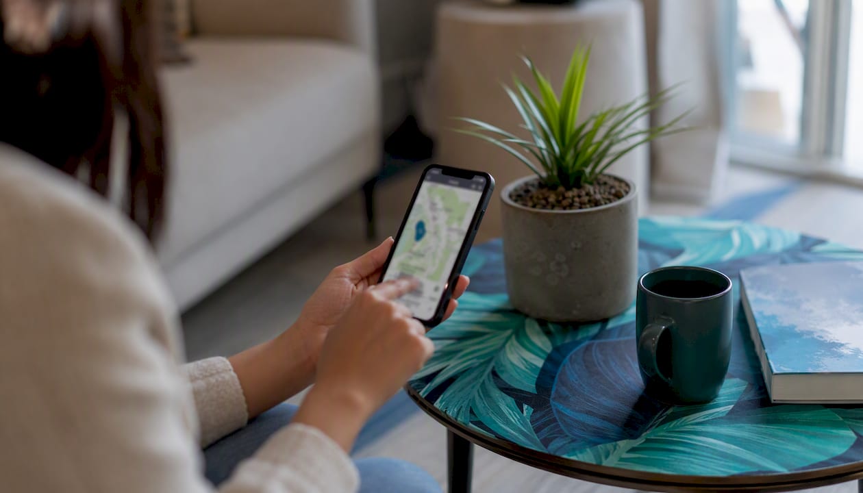 What Is Digital Tenant Support for Property Managers? 2 Hand using mobile device for property mapping