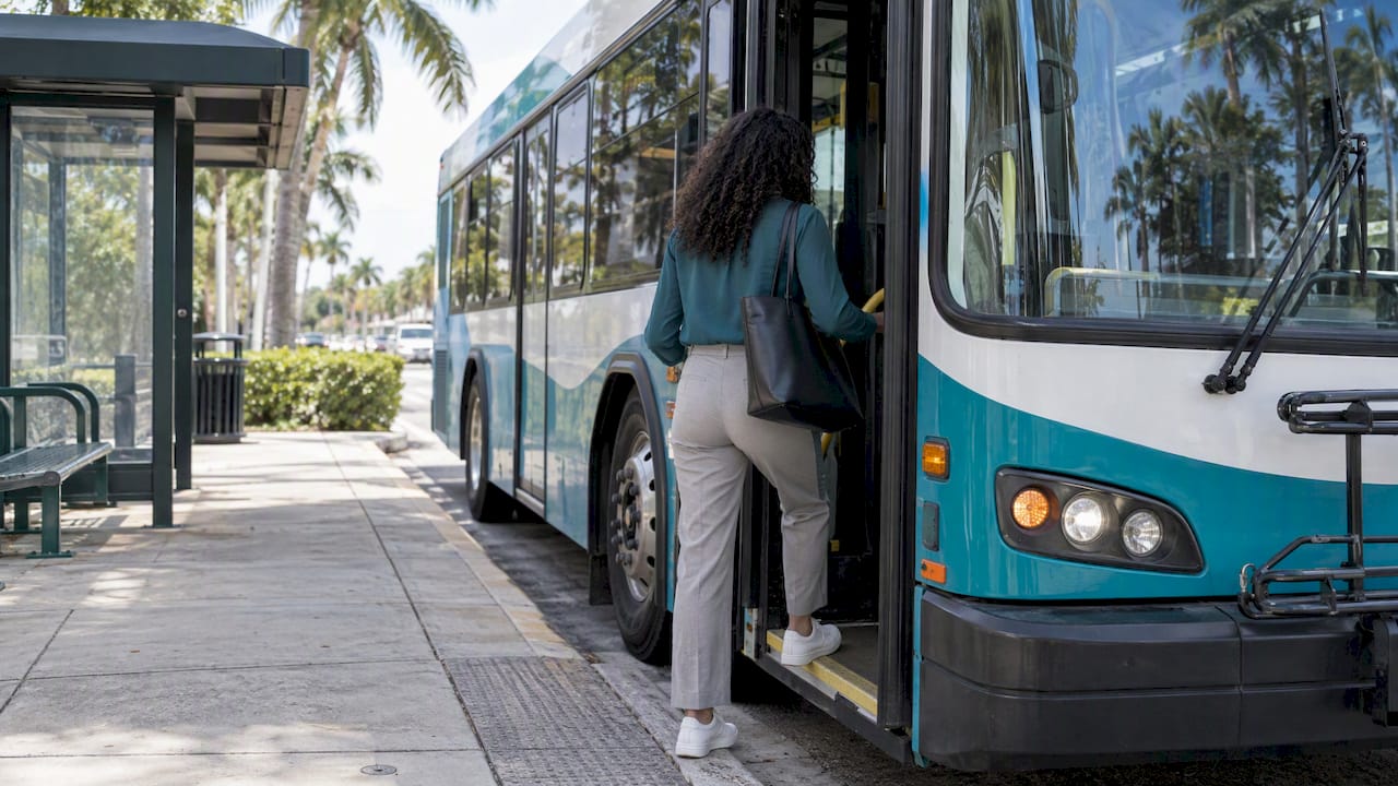 Rider boarding Palm Tran bus in Boca Raton