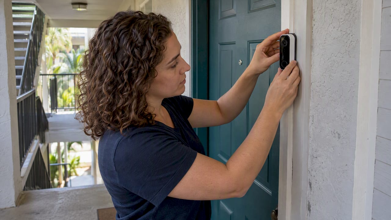 Renter adjusting wireless doorbell camera